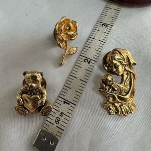 Three goldtone lapel pins